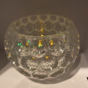 Clear tea light holder with round cut outs